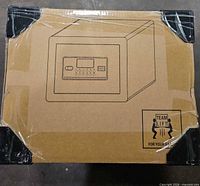 Sealed carton showing line drawing of safe