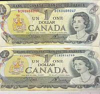 Obverse of both 1973 $1 notes showing Queen Elizabeth II and serial numbers