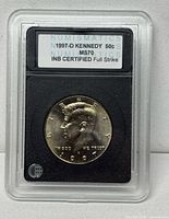 Obverse in slab showing label with grade and details