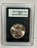 Obverse of slabbed 2000-P Kennedy half dollar showing grading label