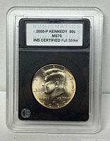 Obverse view of 2000-P Kennedy half dollar inside INB slab