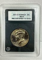 Front of INB slab showing 2001-D Kennedy half dollar and certification label