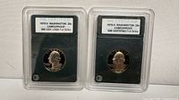 Front view of both INB certified 1976-S proof quarters in holders