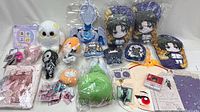 Group shot of all plush cushions, plush dolls, apparel package, keychains and blind boxes