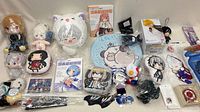 Overview of entire lot showing plush toys, figure box, manga, pins and cloth items