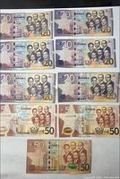 Fronts of eight 20 Cedi and three 50 Cedi notes