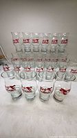 Front view of all 24 Red Lobster glasses in rows