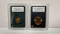Both slabbed coins side by side in holders