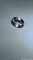 Top view of the faceted oval amethyst showing overall shape, color and cut