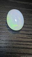 Front view of oval Ethiopian opal showing play-of-color