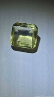 Octagon-cut lemon citrine front view under light