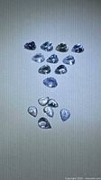 Full group of pear-cut Tanzanite stones laid out