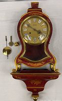 Clock, wall bracket, pendulum, key, finial overview