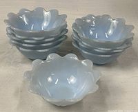 Stacked view of all ten light blue Azur-ite glass bowls