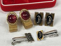 All three pairs of cufflinks and Swank box grouped