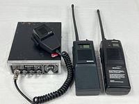 Front view of Midland 13-857 base station, GB 1140 mic, Maxon HCB-30 and 27-LP handheld radios