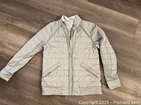 Front view quilted shell side with ribbed trim