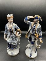 Front view of both Capodimonte figurines