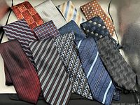 All 13 silk ties arranged to show patterns and colours