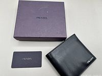 Wallet, box, authenticity card overview
