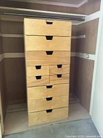 Front view of tallboy dresser showing ten drawers