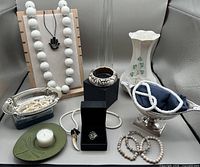 Group shot of all items including vase, silverplate dishes, jewellery, coaster