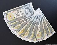 Stacked fan of ten 1973 Canadian $1 notes, obverse visible
