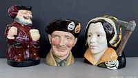 Front view of all three Royal Doulton character jugs