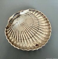 Top view of shell-shaped sterling silver footed dish showing overall form and wear