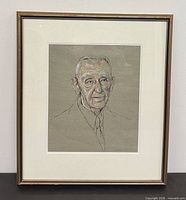 Front view of framed signed portrait drawing