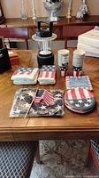Overall lot on table including lantern and patriotic tableware