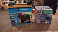 Retail boxes for Pelonis air circulator fan and Conair deluxe fabric steamer