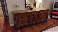 Front view of dresser with mirror, closed drawers