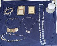 Group shot of all eight items laid out on dark cloth