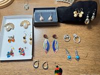 Overview of all costume earrings laid out on table