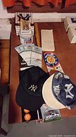 Overview of caps, playing cards, Reggie Bar, tickets, collectible tin