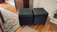 Pair of closed cube ottomans side by side