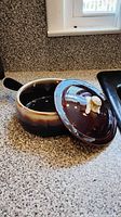 Brown glazed ceramic lidded saucepan with handle, lid off