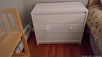 White dresser front view, closed drawers