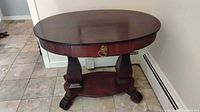 Oval dark cherry side table front view