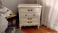 Front view of one nightstand with drawers closed