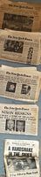 Stack of New York Times and Daily News issues showing front pages