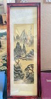 Framed vertical Asian landscape print in wood frame with mat