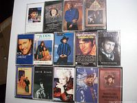 All fourteen country music cassette tapes laid out showing front cover art