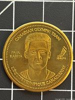 Obverse of Paul Kariya Olympic coin showing portrait and inscriptions