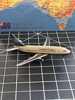 Left side profile of the diecast Boeing 737-200 model on grid background