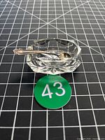 Salt cellar and sterling spoon top perspective