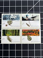 Front of stamp block showing four forest designs and 39¢ denomination