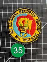 Front view of embroidered patch with grid for scale