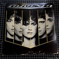 Front jacket showing album art, band name Toronto, yellow bars, visible wear